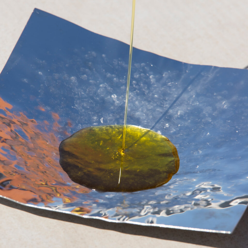 "Designer Stainless Steel Bowl – the Balance Bowl in use, showcasing its dynamic design and functionality during an olive oil tasting experience."